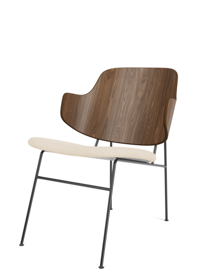The Penguin Lounge Chair in Walnut with a Logan Jasmine upholstered seat and black steel frame, viewed from the side.