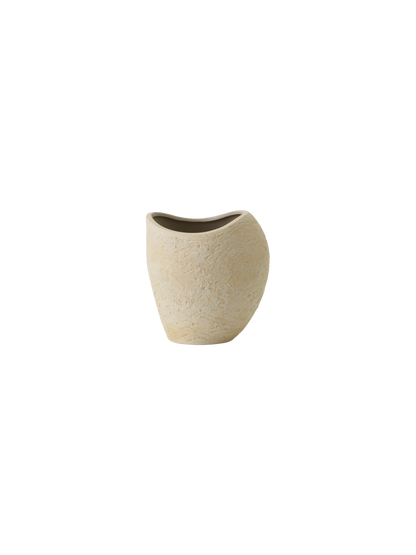 Front view of the Plantas Planter in ivory. The ceramic planter has an organic, asymmetrical shape and a textured finish.
