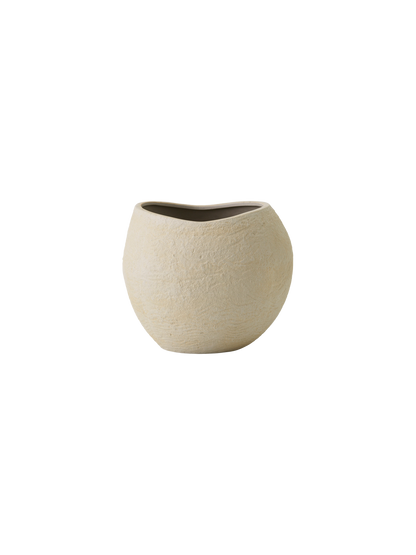 Front view of the ivory Plantas Planter. A rounded, organic shape with a rough, textured surface against a black background.