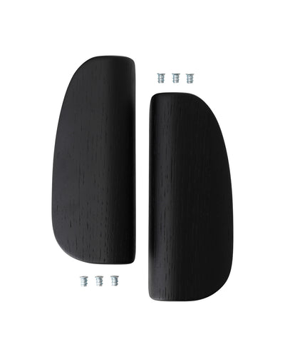 Pair of black oak curved armrest panels with visible wood grain, shown vertically with four small metal mounting inserts.