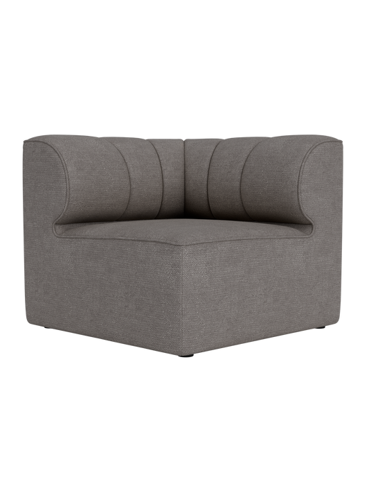 Eave Seamline Modular Sofa 86 Corner in Audo Bouclé 16, a dark grey fabric with rounded back and vertical stitch details.