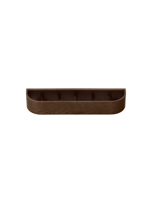 Dark stained oak Epoch Rack, a minimalist wall-mounted coat rack with a curved wood frame and hidden clothing hooks.