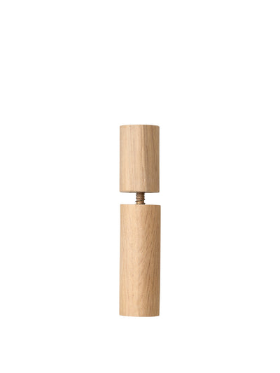 Front view of a cylindrical object made of light-coloured wood, presented in two parts connected by a central metal screw.