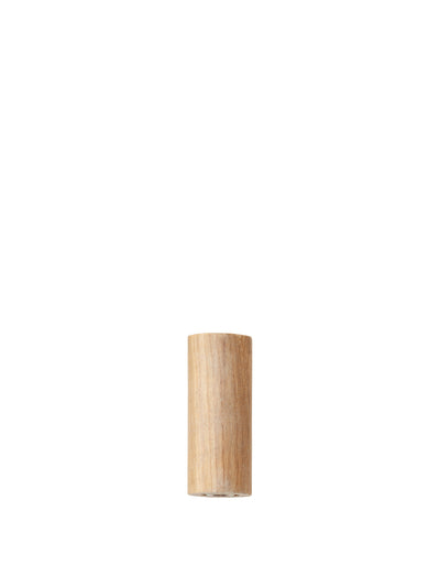 A front-on studio shot of a small, cylindrical wooden component with a light finish, on a white background.