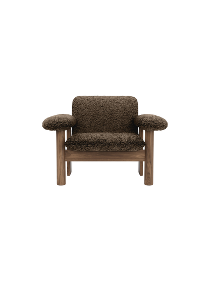 Front view of the Brasilia Lounge Chair, Low Back, with a dark wood frame and plush, dark brown sheepskin upholstery.