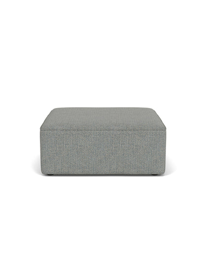 A front-on view of the rectangular Eave Modular Sofa Pouf, upholstered in a textured, grey-blue Safire fabric.