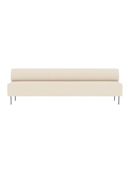 Front view of the Eave Dining Sofa in cream Logan Jasmine upholstery, showing its long, minimalist form and thin metal legs.