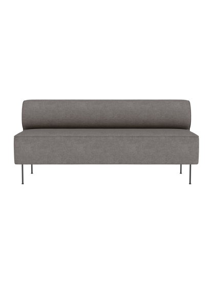 Front view of the minimalist Eave Dining Sofa in Audo Bouclé 16, with a rounded backrest and slender metal legs.