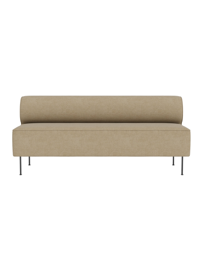 Front view of the Eave Dining Sofa in light beige Audo Bouclé 02 fabric, featuring a bolster back and slim metal legs.