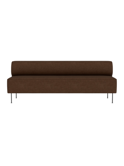 Front view of Eave Dining Sofa, Open section module, in brown upholstery with slender metal legs against a black background.