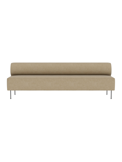 A front view of the Eave Dining Sofa in a light beige Audo Bouclé 02 fabric, featuring a low backrest and slender metal legs.