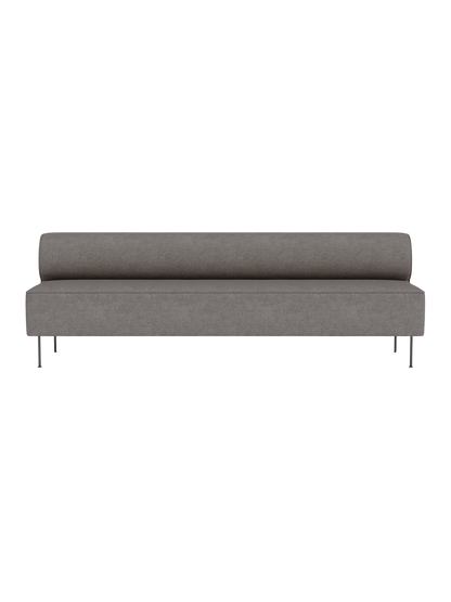 Front view of the Eave Dining Sofa in grey Audo Bouclé 16 fabric, showing its long, low profile and slender metal legs.