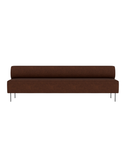 Front view of the brown Eave Dining Sofa. The long, minimalist sofa features a low back and slender, dark metal legs.