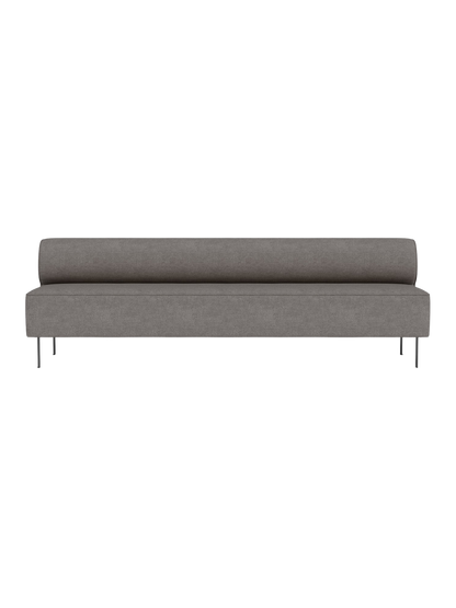 Front view of the Eave Dining Sofa in grey Audo Bouclé 16 fabric, a long minimalist banquette with a low back on slim legs.