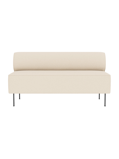 Front view of the Eave Dining Sofa in light cream Logan Jasmine fabric, with a rounded backrest and slender black legs.
