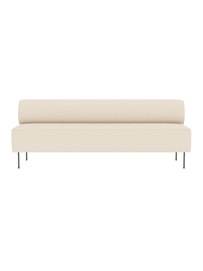 A minimalist Eave Dining Sofa in cream 'Logan Jasmine' fabric, viewed from the front. It features a long seat and slim legs.