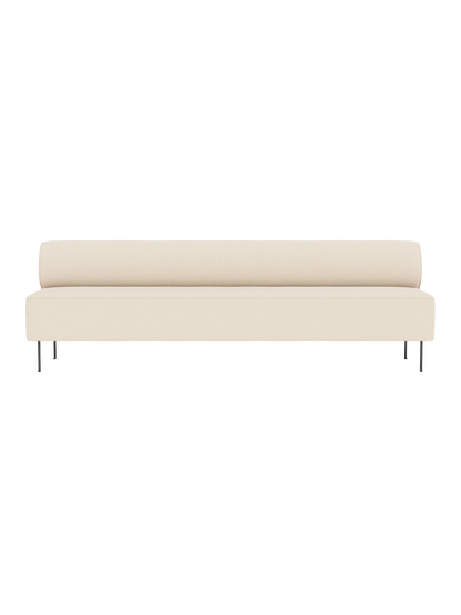 Front view of the Eave Dining Sofa in cream Logan Jasmine fabric, with a long seat, rounded backrest, and slim black legs.