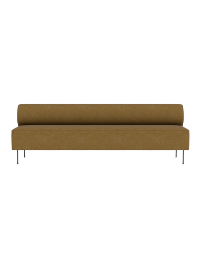 Front view of Eave Dining Sofa in brownish-mustard upholstery. A minimalist banquette with a low back and slim metal legs.