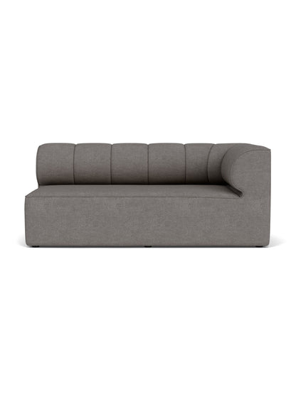 A front-facing, studio shot of the Eave Seamline Modular Sofa, Corner 172, in a textured grey Audo Bouclé 16 fabric.
