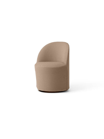 Angled view of the Tearoom Club Chair with Swivel and loose cover, upholstered in textured, light brown Logan Flint fabric.