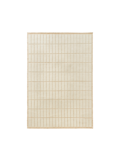 Top-down view of a square, cream-coloured rug featuring a grid pattern of raised rectangular tiles with a textured border.