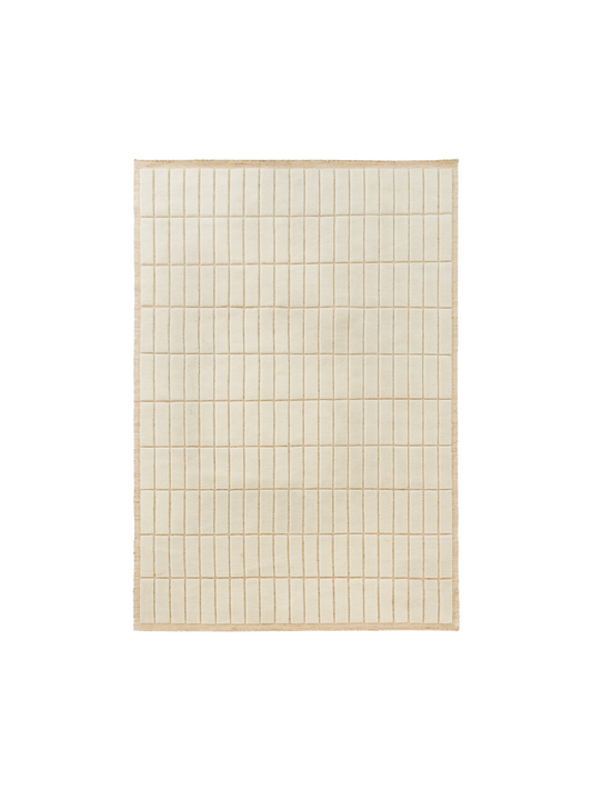 Top-down view of a square, cream-coloured rug featuring a grid pattern of raised rectangular tiles with a textured border.