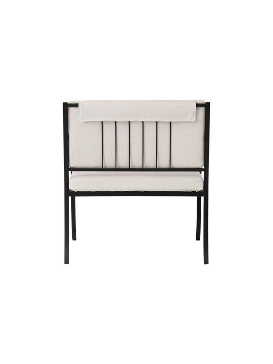 Bloss Garden Lounge Chair viewed from the back, showcasing its black powder-coated steel frame and light outdoor cushions.