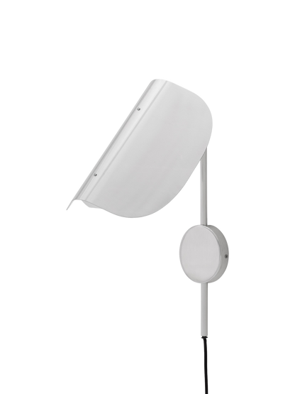 An angled view of the Wing Wall Lamp in polished aluminium. The light is off, showing the curved shade, support arm and cord.