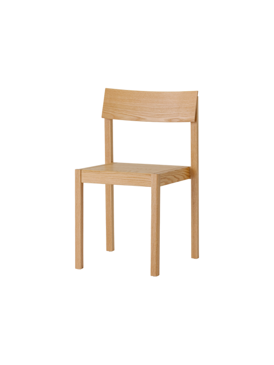 Natural oak Mauro Dining Chair with a minimalist veneer seat and curved backrest, shown from a three-quarter angle.