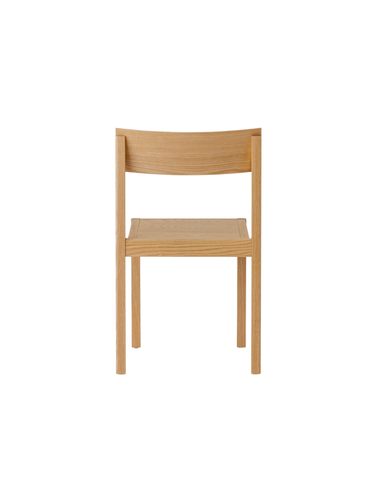 Mauro Dining Chair in natural oak, back view, showing its solid wood frame and form-pressed veneer backrest.