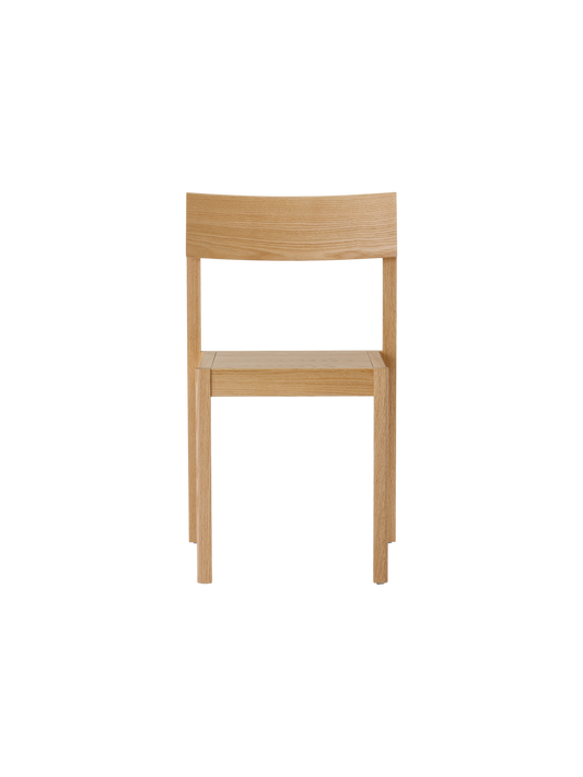 Natural oak Mauro Dining Chair with a veneer seat and minimalist solid wood frame, viewed from the front.