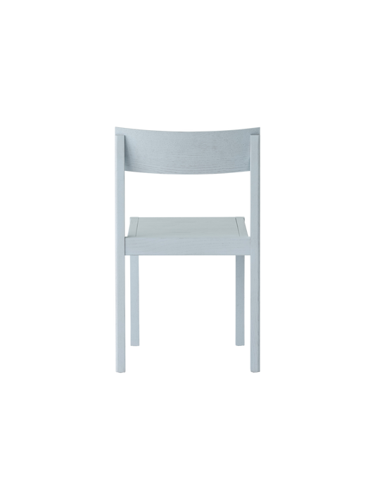 Mauro Dining Chair in linen blue oak, featuring a curved veneer backrest and solid wood frame, shown from the rear.