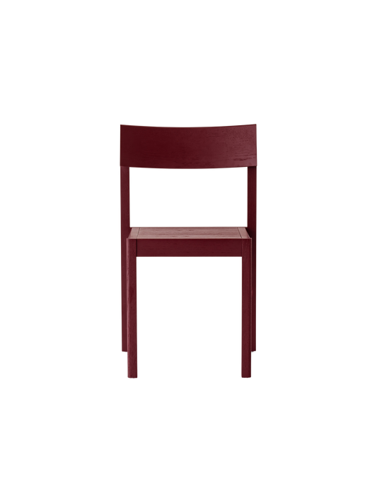 Mauro Dining Chair in French red oak, featuring a curved veneer seat and backrest on a solid wood frame.
