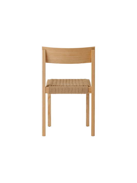 Rear view of the Mauro Dining Chair in natural oak, highlighting the curved backrest and woven papercord seat.