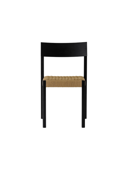 Black Mauro Dining Chair featuring a solid oak frame and a handwoven paper cord seat in a minimalist Danish style.