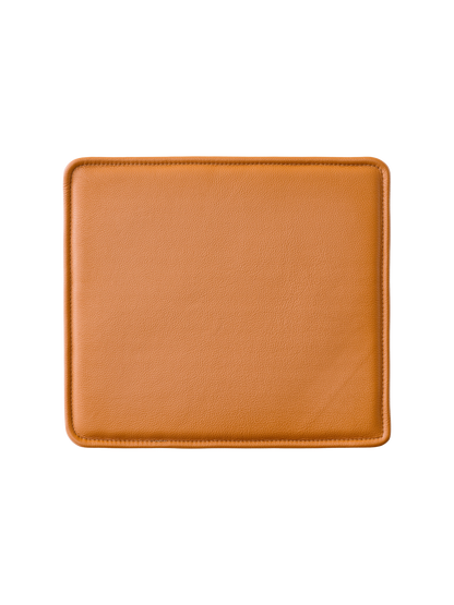 Mauro Dining Chair Seat Cushion in Madras Cognac leather with a textured surface and rounded corners.