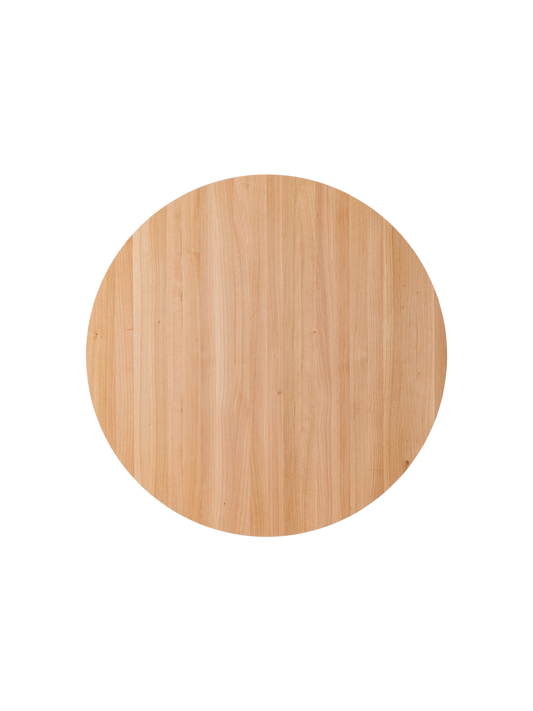 Overhead view of the round Puffin Dining Table in natural solid oak, highlighting the organic wood grain texture.