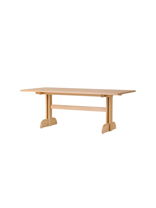 Rectangular Puffin Dining Table in natural oak, featuring a solid oak base and clean, Shaker-inspired design details.