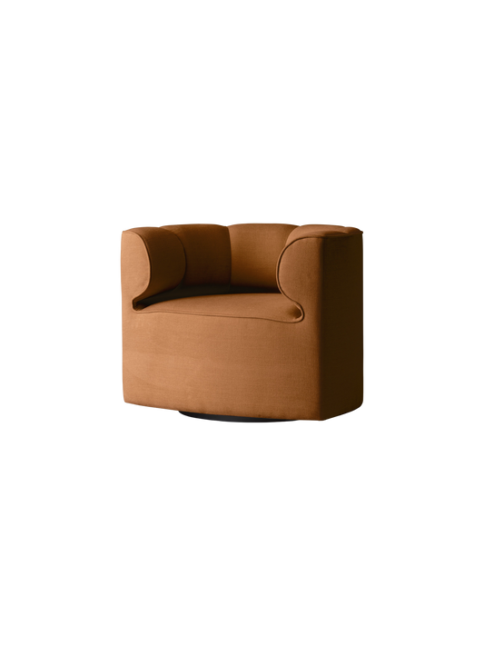 Eave Seamline Lounge Chair in Siennatonal 06, a sculptural burnt orange upholstered chair with a low-profile design.