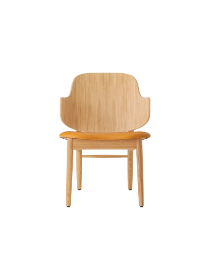 The Penguin Wooden Lounge Chair in natural oak with an orange Aida 0250 upholstered seat, shown from the front.
