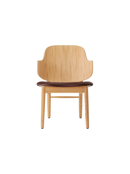 The Penguin Wooden Lounge Chair in natural oak with a dark brown Aida 0329 upholstered seat.