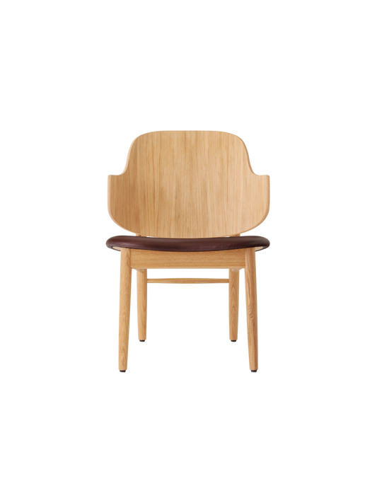 The Penguin Wooden Lounge Chair in natural oak with a dark brown Aida 0329 upholstered seat.