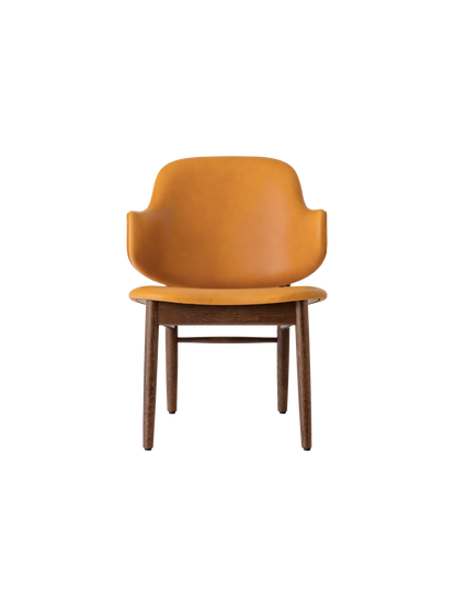 The Penguin Wooden Lounge Chair with a red-stained oak frame and orange Aida 0250 upholstery, shown from the front.