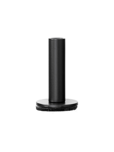 A black, T-shaped metal object with a cylindrical stem and a circular base with a felt pad, shown against a white background.