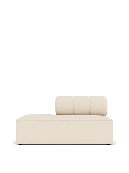 A front-on view of the Eave Seamline Modular Sofa's open-end module, upholstered in a light-coloured textured fabric.