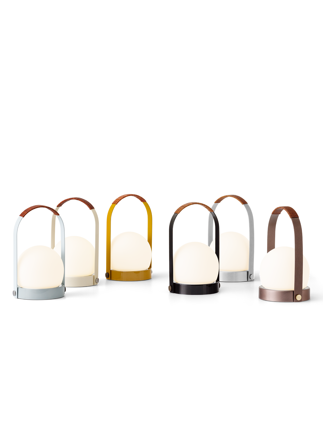 Carrie Portable Lamps in a range of finishes featuring glowing opal glass shades and leather-wrapped handles.