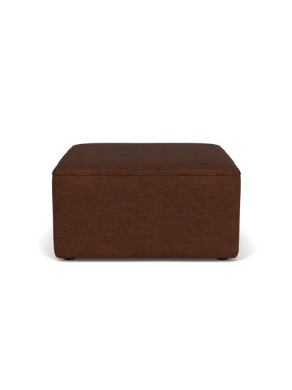 A side view of the Eave Modular Pouf, 75, upholstered in a textured brown Audo Bouclé 08 fabric against a black background.