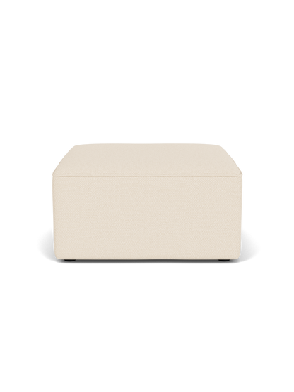Eave Modular Pouf, 75, a square ottoman upholstered in a textured, light beige Logan Jasmine fabric on a black background