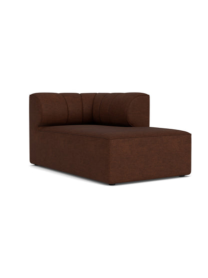 A studio shot of the Eave Seamline Modular Sofa, 86, Chaise Longue, upholstered in a textured, brown Audo Bouclé 08 fabric.