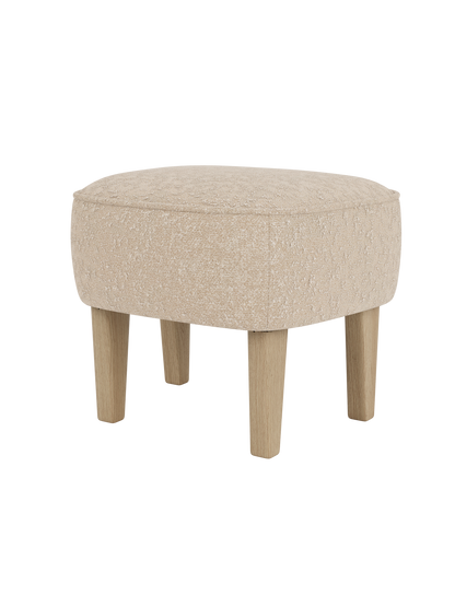 The Ingeborg Ottoman by Flemming Lassen, upholstered in a textured light beige fabric with four solid natural oak legs.